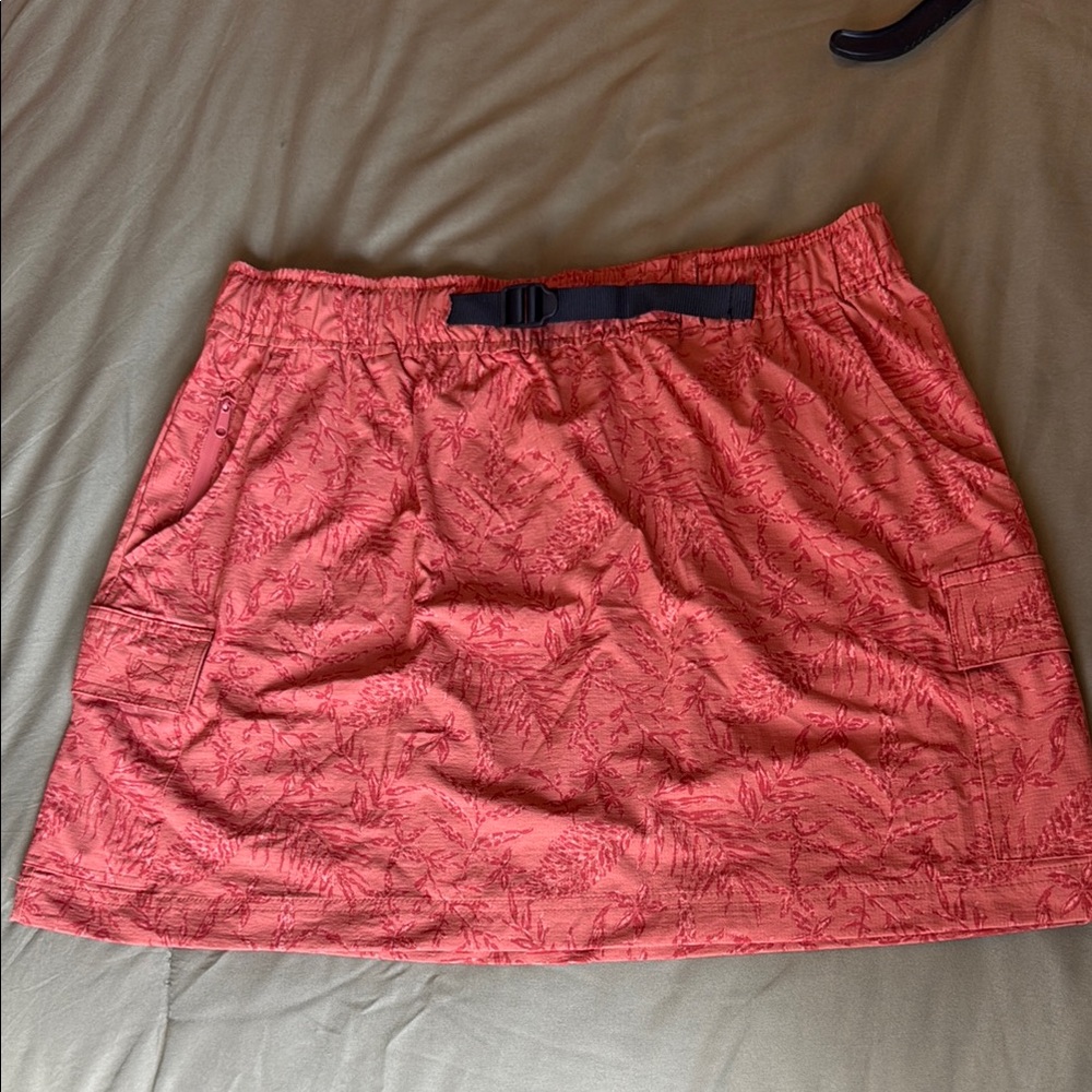 Woman’s orange athletic/hiking skirt